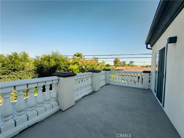 a bedroom with a bed and a potted plant