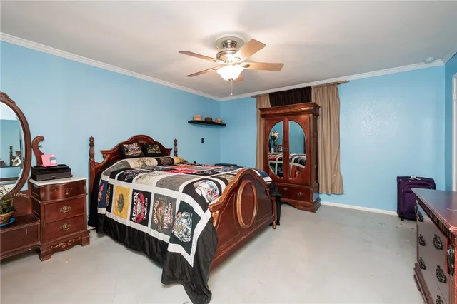 a bed room with a bed and a chandelier