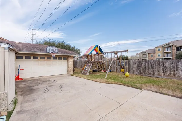 a view of a garage with a patio