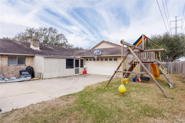 a view of a house with basketball court