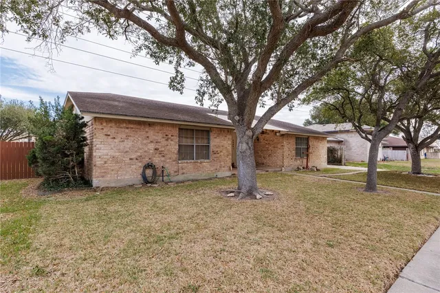 a house with trees in front of it