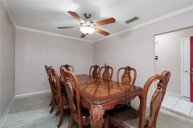 a view of a dining room with furniture