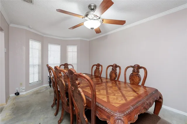 a view of a a dining room with furniture window and wooden floor