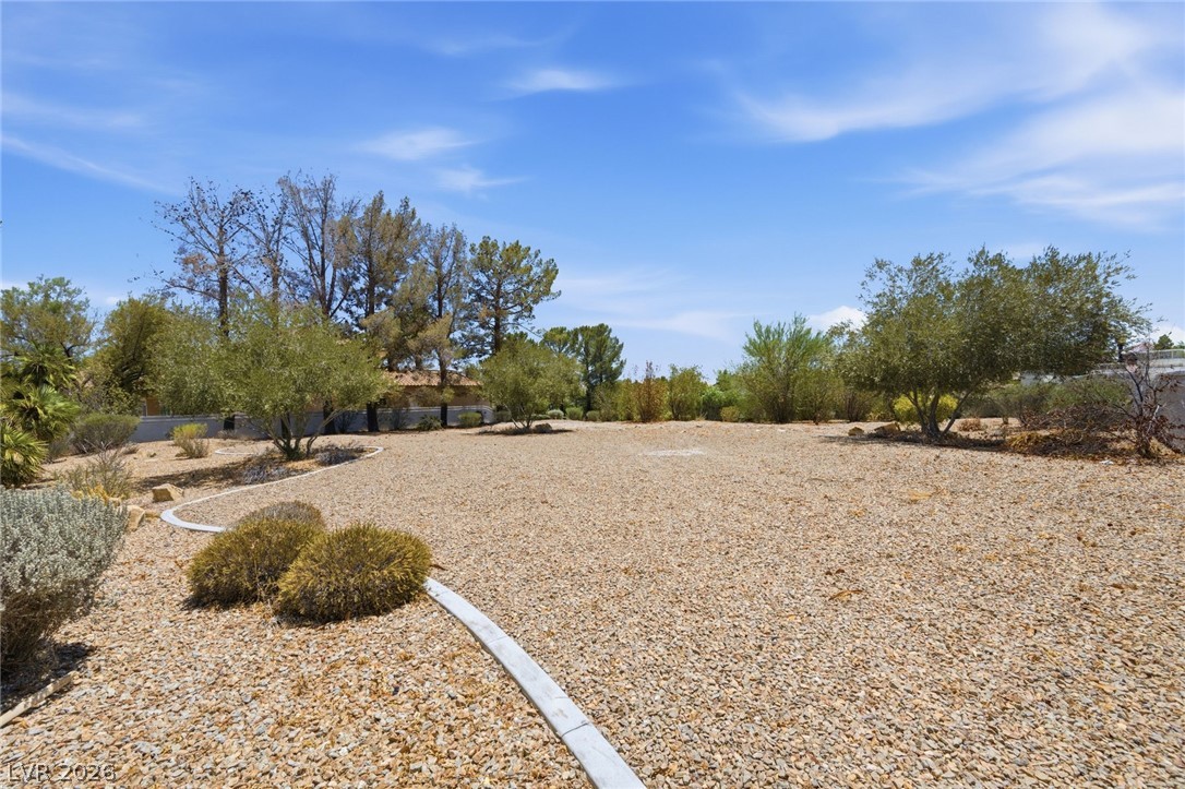 20 Innisbrook Avenue Las Vegas, NV 89113 - Photo 12 of 39 A spacious, gravel-covered lot awaits your creative landscaping vision.