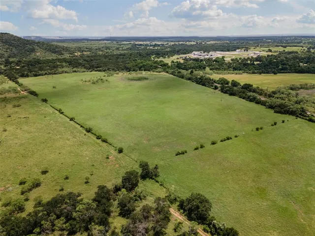 an aerial view of residential building with outdoor space lake and green space