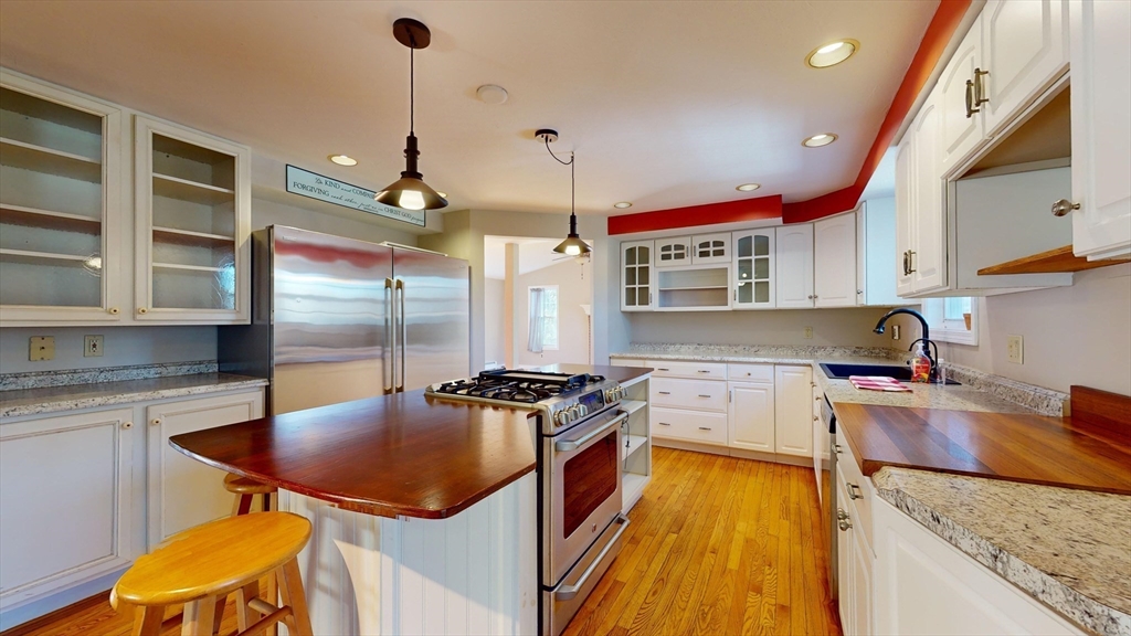53 Dogwood Road Hubbardston, MA 01452 - Photo 11 of 42 a kitchen with a stove a refrigerator and a sink