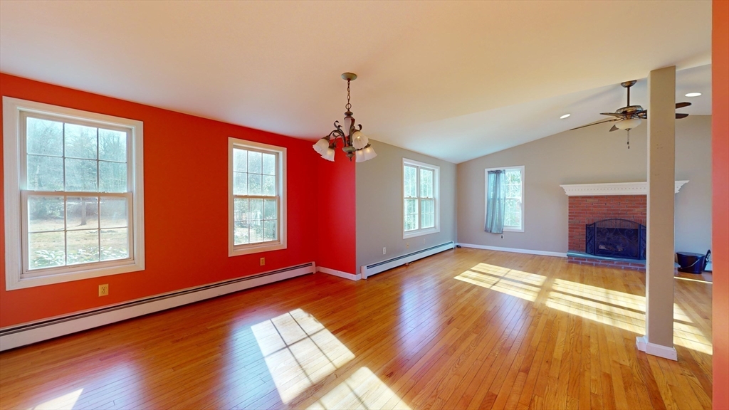 53 Dogwood Road Hubbardston, MA 01452 - Photo 16 of 42 a view of an empty room with window and wooden floor