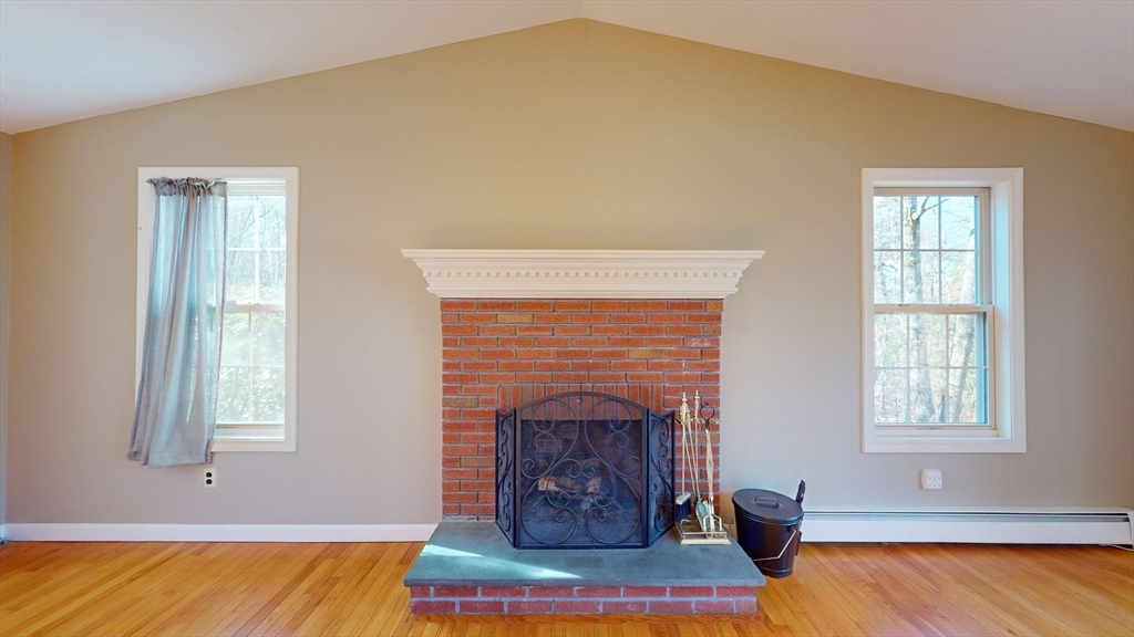 53 Dogwood Road Hubbardston, MA 01452 - Photo 18 of 42 a living room with furniture and a fireplace