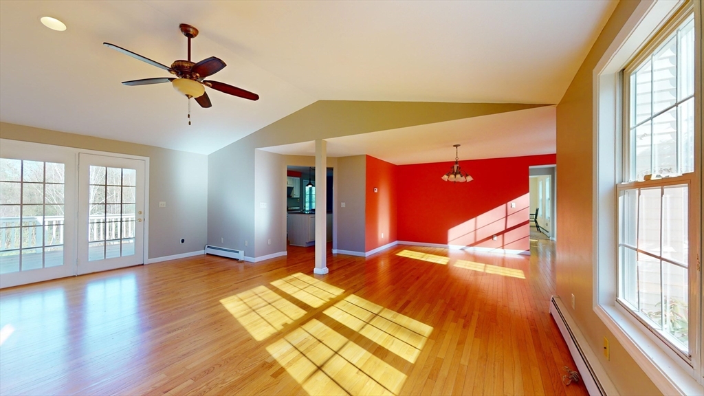 53 Dogwood Road Hubbardston, MA 01452 - Photo 21 of 42 a bedroom with a bed and wooden floor