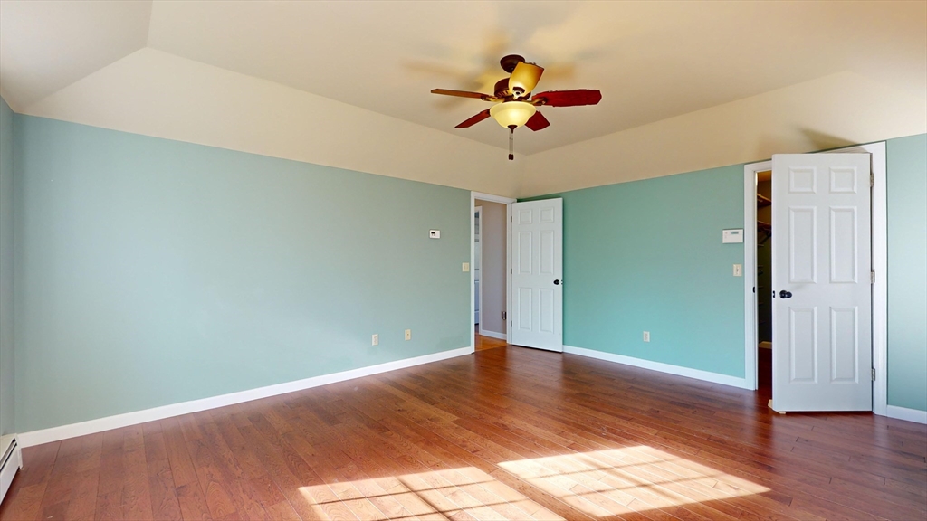 53 Dogwood Road Hubbardston, MA 01452 - Photo 28 of 42 an empty room with wooden floor and fan