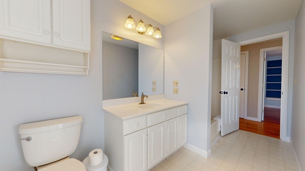 53 Dogwood Road Hubbardston, MA 01452 - Photo 34 of 42 a bathroom with a toilet sink and mirror