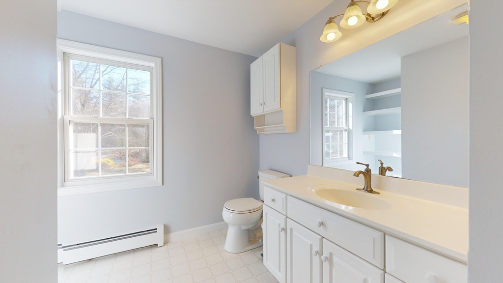 53 Dogwood Road Hubbardston, MA 01452 - Photo 35 of 42 a bathroom with a sink double vanity and a toilet