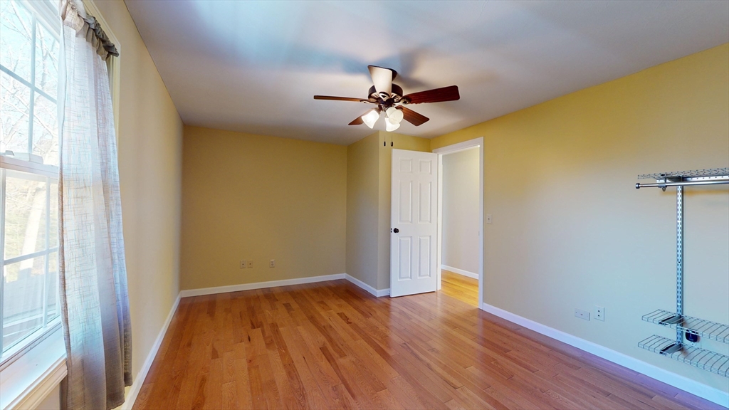 53 Dogwood Road Hubbardston, MA 01452 - Photo 37 of 42 a view of empty room with wooden floor and fan