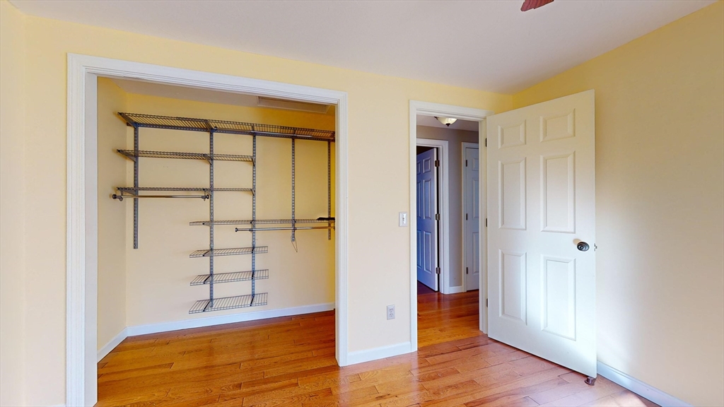 53 Dogwood Road Hubbardston, MA 01452 - Photo 38 of 42 an empty room with wooden floor and closet