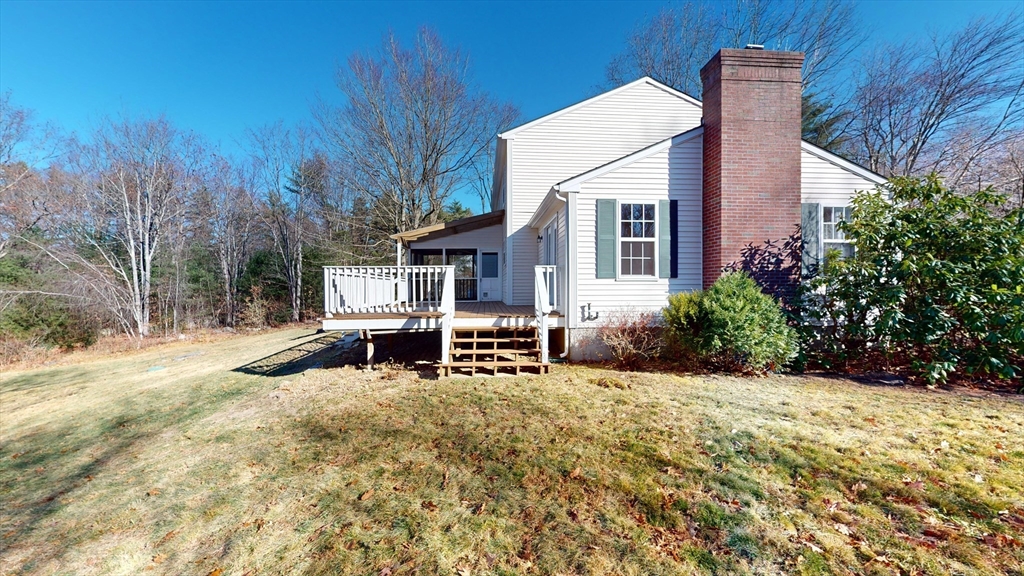 53 Dogwood Road Hubbardston, MA 01452 - Photo 5 of 42 a view of a house with backyard and sitting area