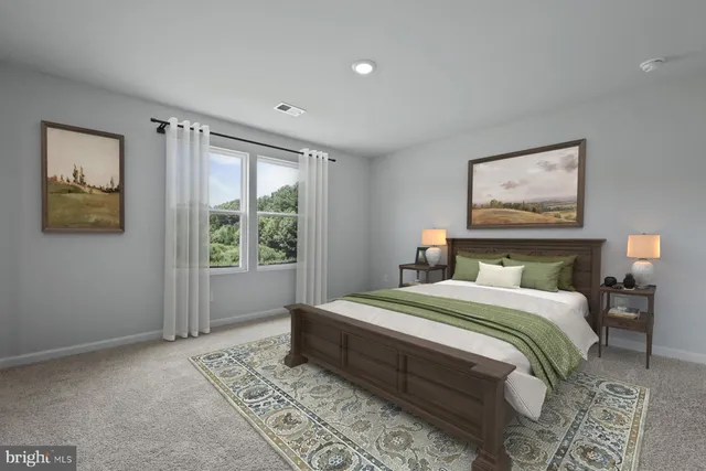 a bedroom with a large bed and a window