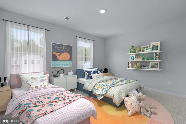 a bedroom with two beds and a large window