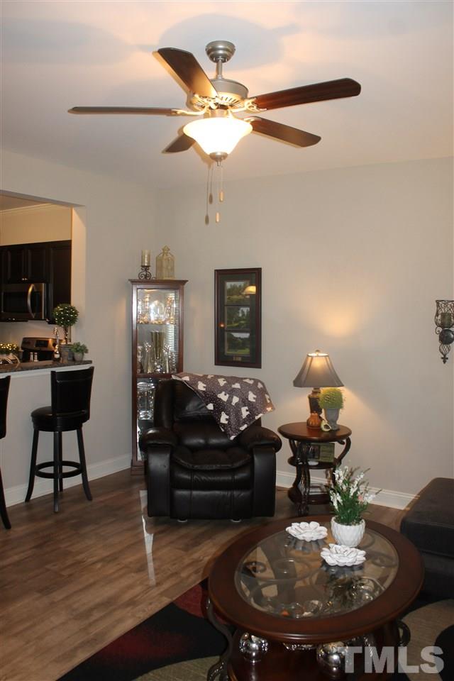 3972 Volkswalk Place Raleigh, NC 27610 - Photo 15 of 24 a living room with furniture and a fireplace