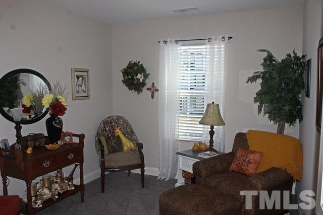 3972 Volkswalk Place Raleigh, NC 27610 - Photo 17 of 24 a living room with furniture and a window