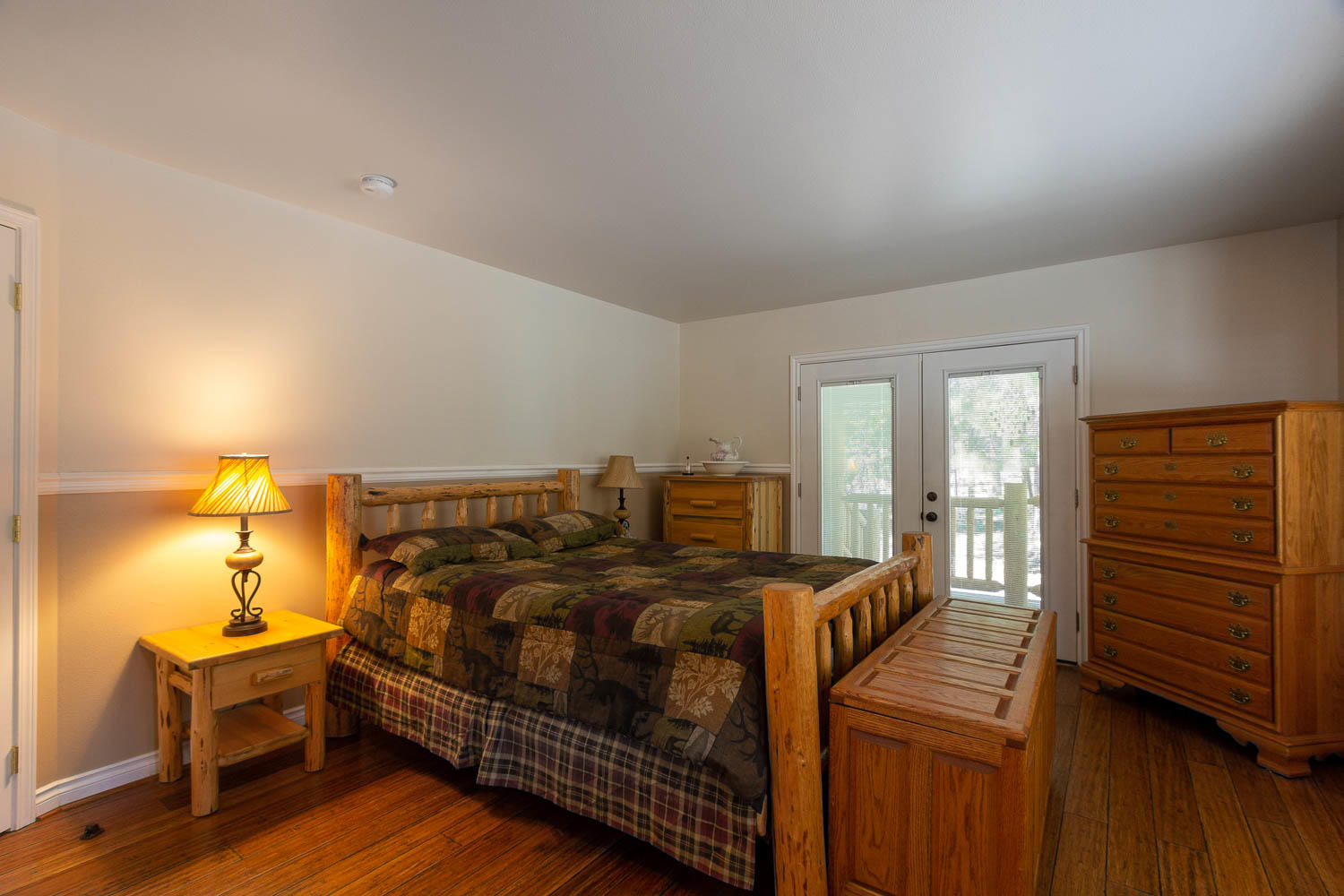 17151 Merced Road Bend, OR 97707 - Photo 12 of 30 a bedroom with a bed and a dresser