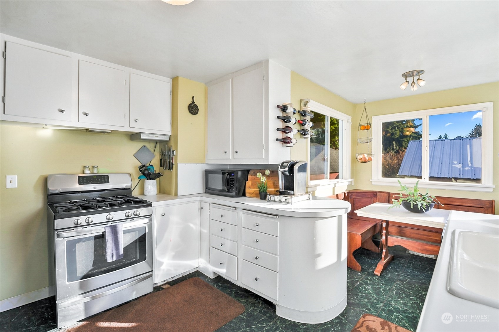2322 Cherry Road Lake Stevens, WA 98258 - Photo 11 of 35 a kitchen with white cabinets and white appliances