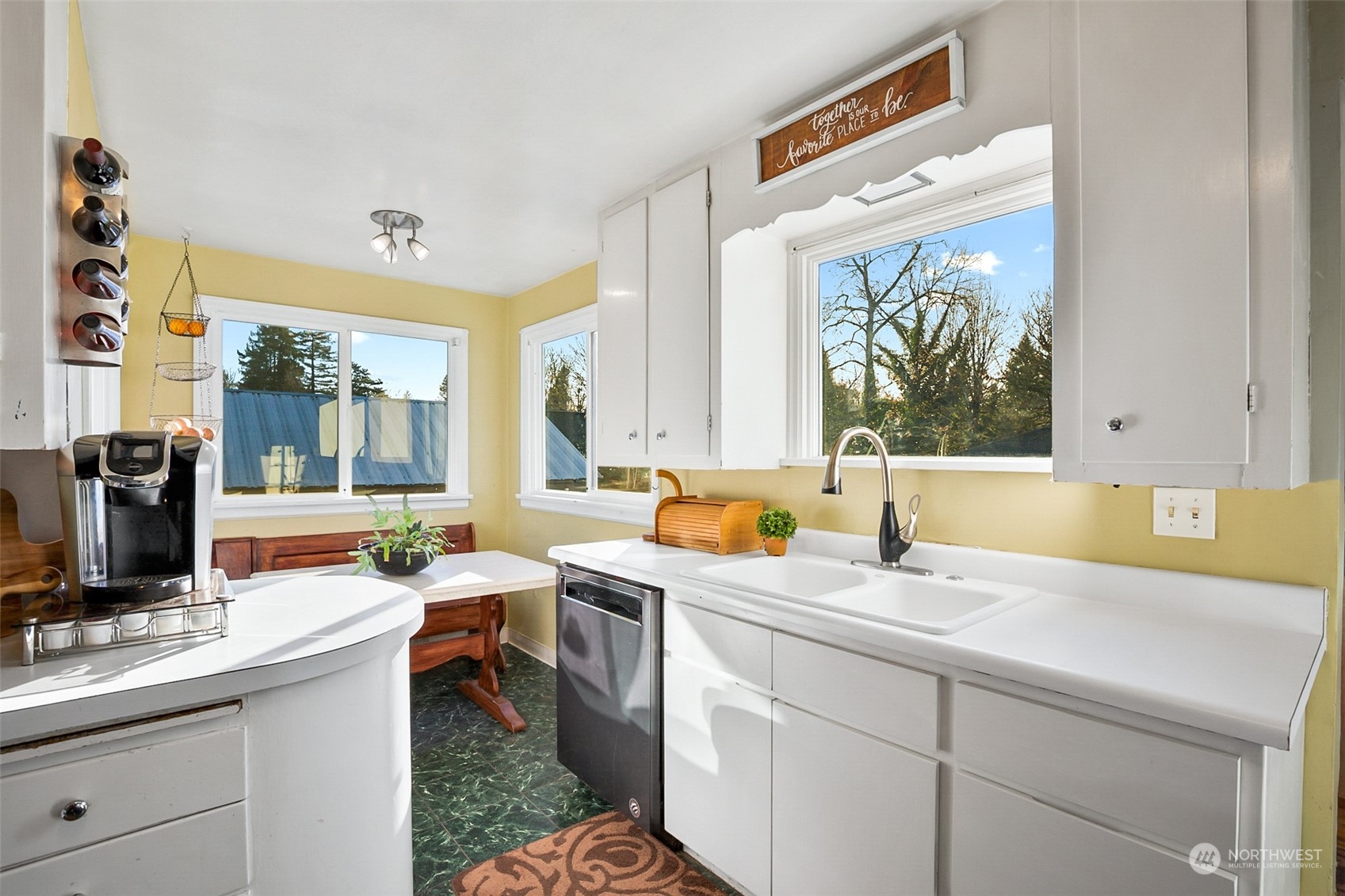 2322 Cherry Road Lake Stevens, WA 98258 - Photo 14 of 35 a view of a sink and dishwasher with wooden floor