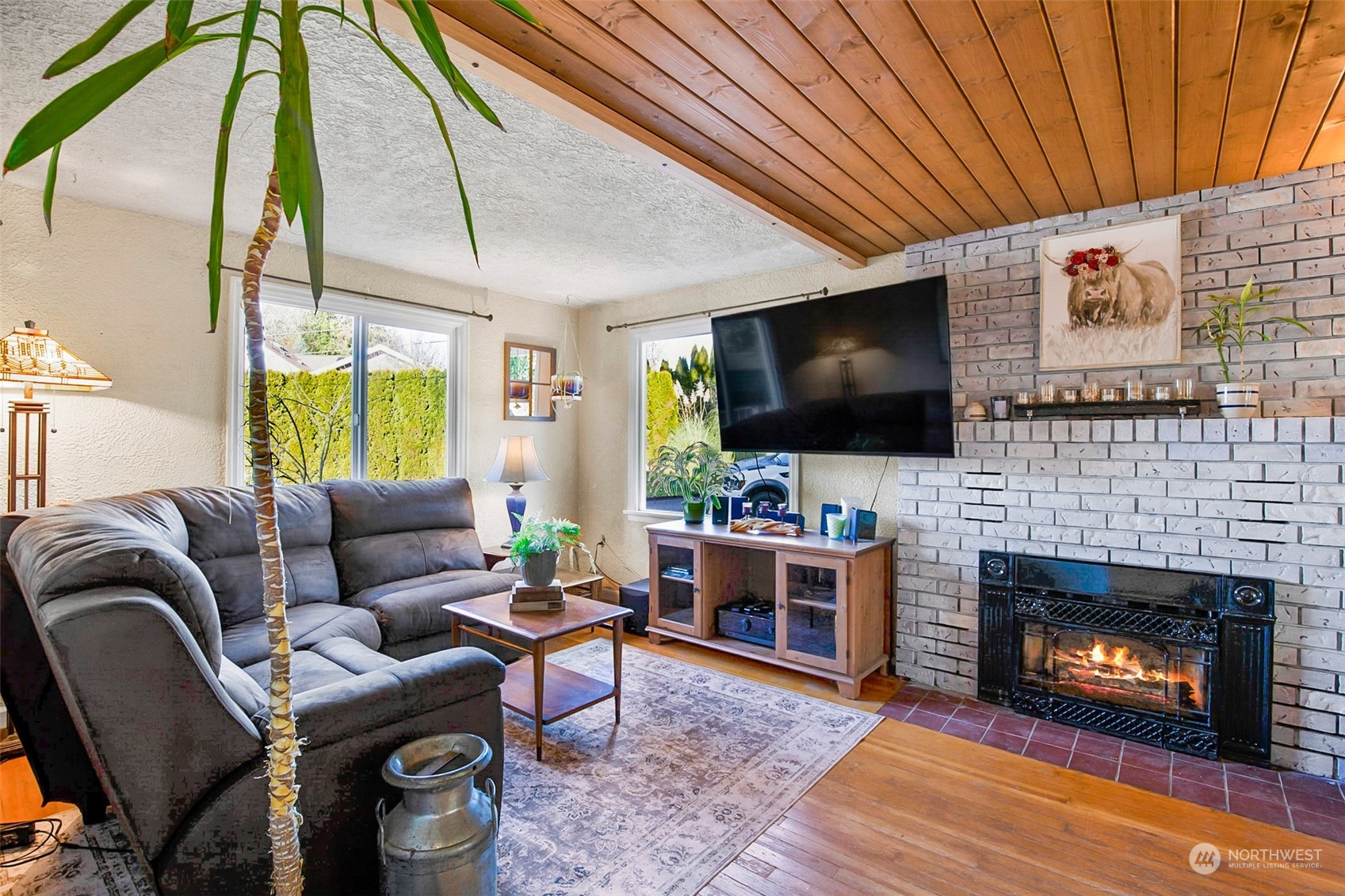 2322 Cherry Road Lake Stevens, WA 98258 - Photo 6 of 35 a living room with furniture a flat screen tv and a fireplace