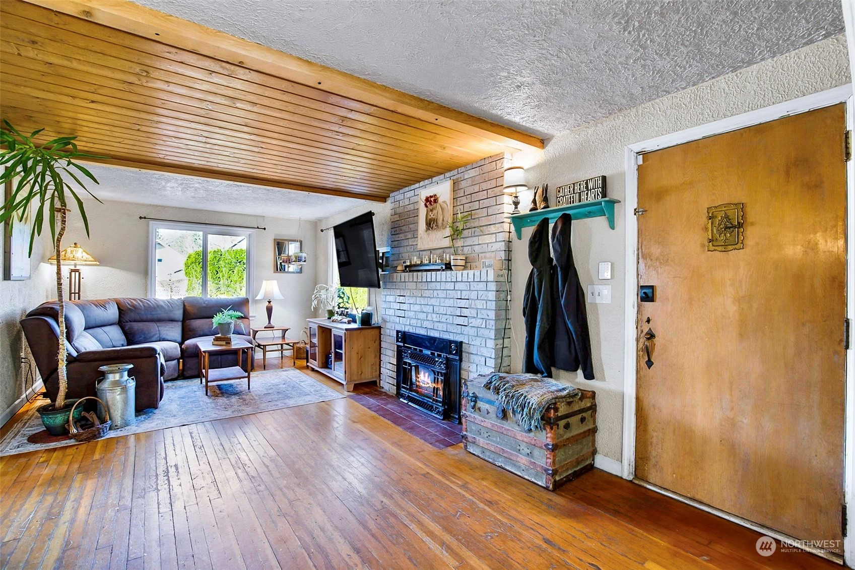 2322 Cherry Road Lake Stevens, WA 98258 - Photo 8 of 35 a living room with furniture large window and a fireplace