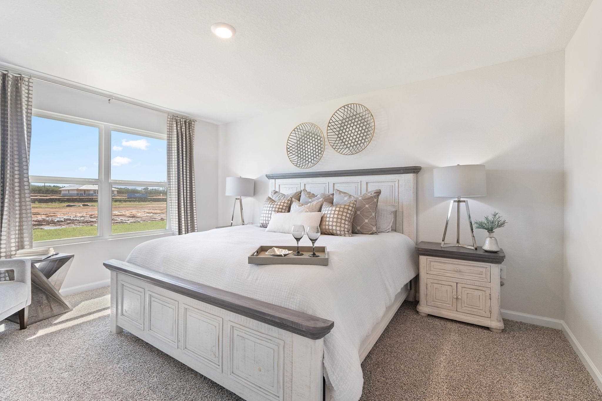 7505 Saddlebrook Avenue Pace, FL 32571 - Photo 13 of 16 a bed sitting in a bedroom next to a window