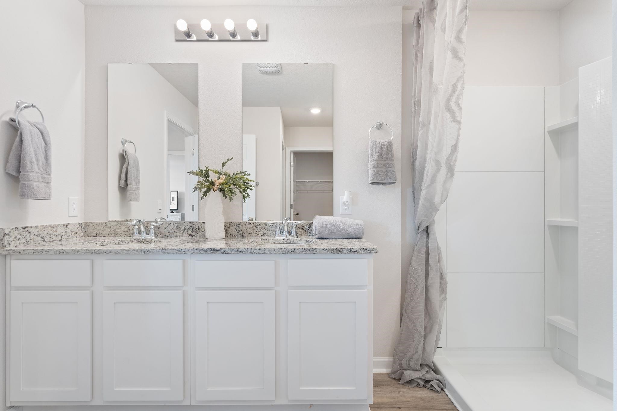 7505 Saddlebrook Avenue Pace, FL 32571 - Photo 14 of 16 a bathroom with a granite countertop sink and a mirror
