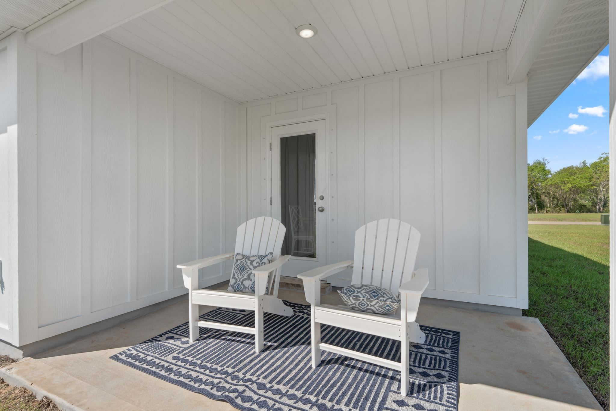 7505 Saddlebrook Avenue Pace, FL 32571 - Photo 15 of 16 a dining room with furniture and wooden floor