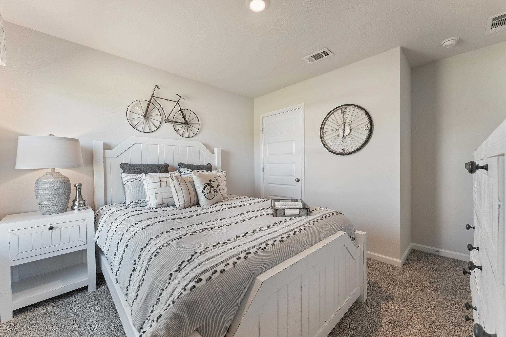 7505 Saddlebrook Avenue Pace, FL 32571 - Photo 5 of 16 a bedroom with a bed and a table in it