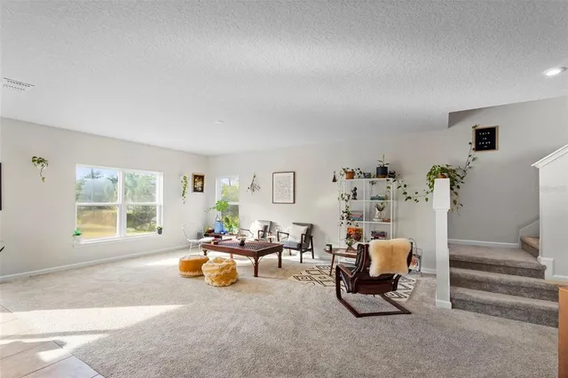 a kitchen with stainless steel appliances granite countertop lots of counter top space and wooden floor