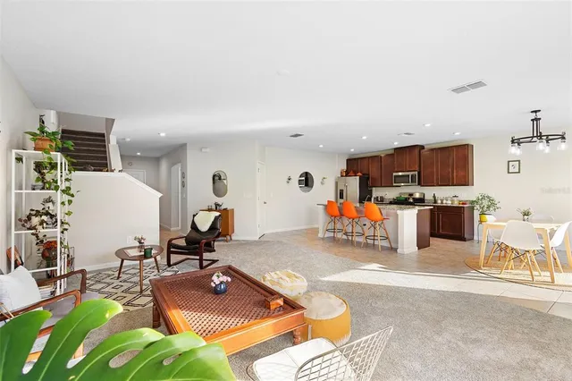 a view of a dining room with furniture window and outside view