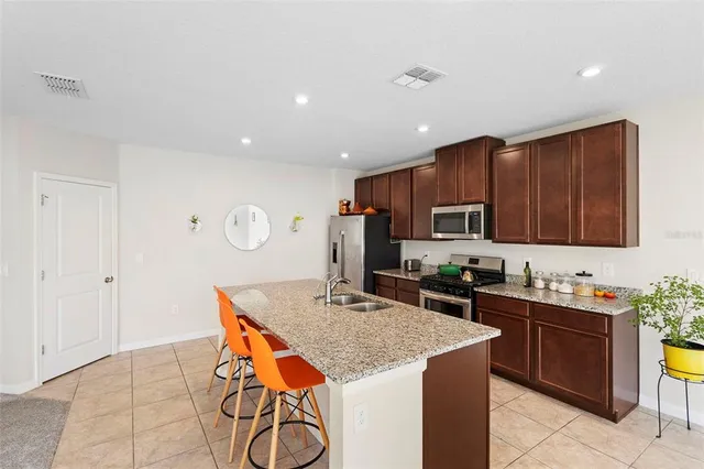 a bedroom with a bed and a ceiling fan