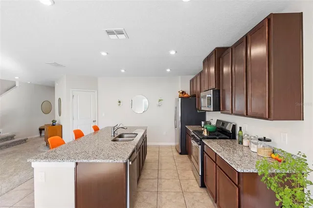 a spacious bathroom with a double vanity sink a mirror and a shower