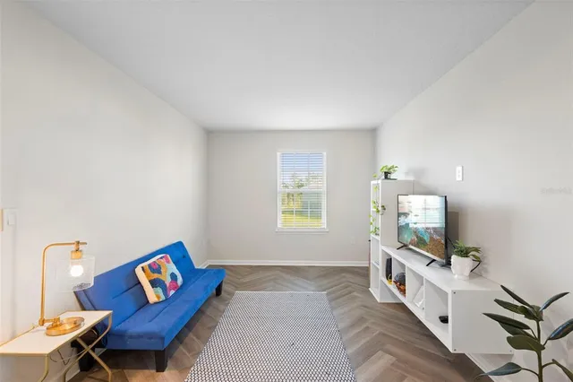 a bathroom with a toilet a sink and a large mirror