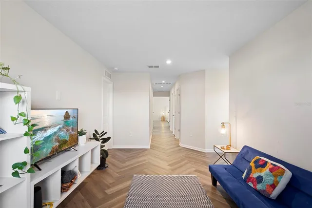 a white toilet sitting next to a small bathroom