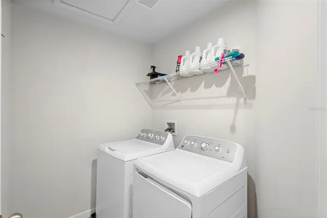 an aerial view of residential houses with yard