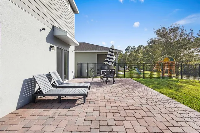 an aerial view of houses with yard