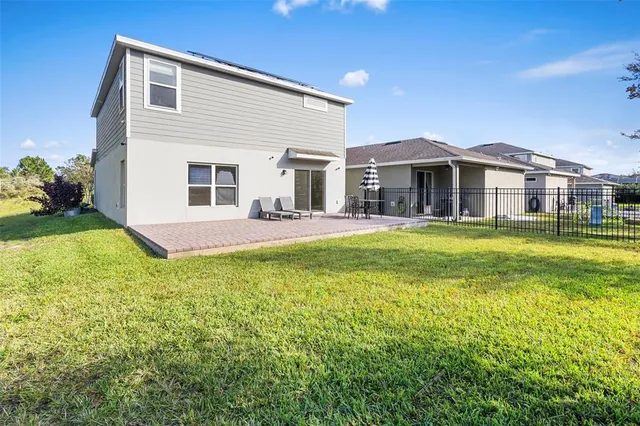 an aerial view of residential house with outdoor space and lake view