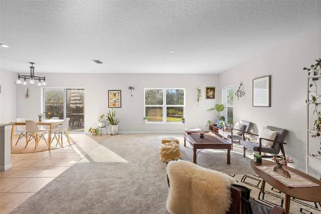 a kitchen with stainless steel appliances granite countertop a sink a stove counter space and cabinets