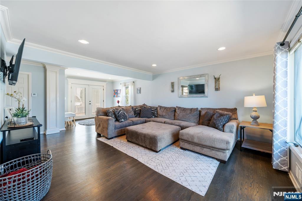 25 Glenview Road Nutley, NJ 07110 - Photo 17 of 49 a living room with furniture a rug and a flat screen tv