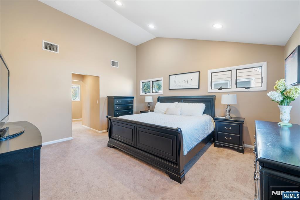 25 Glenview Road Nutley, NJ 07110 - Photo 25 of 49 a spacious bedroom with a bed and a desk