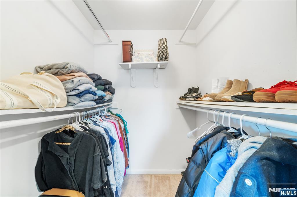 25 Glenview Road Nutley, NJ 07110 - Photo 30 of 49 a view of walk in closet with clothes and shoes
