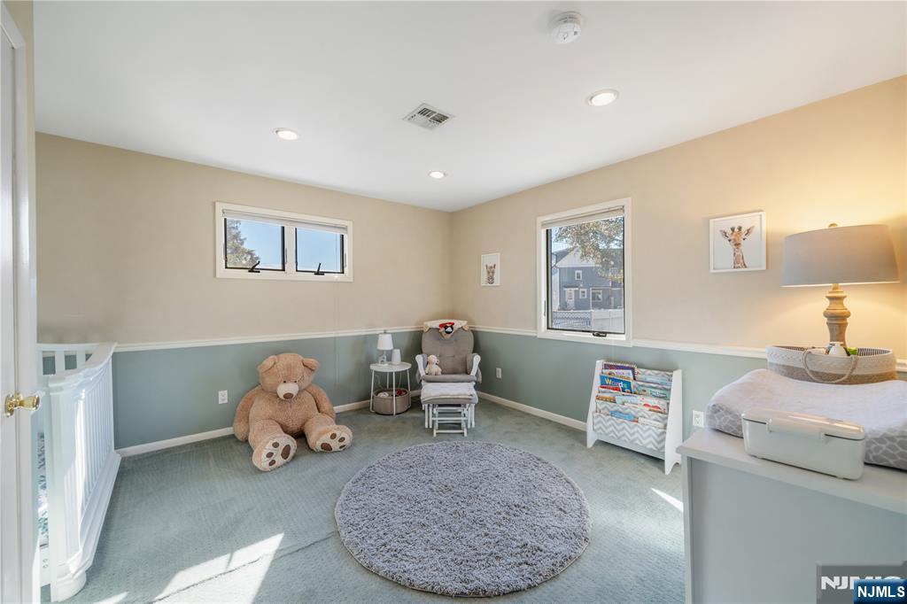 25 Glenview Road Nutley, NJ 07110 - Photo 33 of 49 a bed room with a bed and a chair