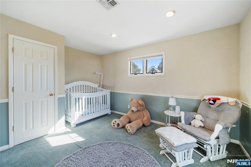 25 Glenview Road Nutley, NJ 07110 - Photo 34 of 49 a bedroom with furniture and a rug