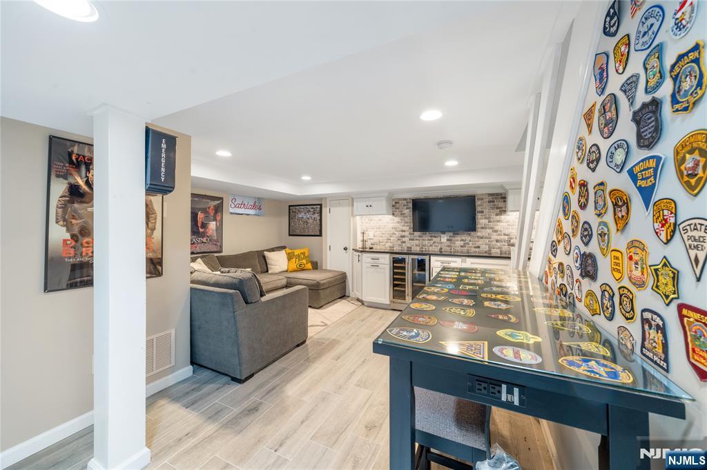25 Glenview Road Nutley, NJ 07110 - Photo 37 of 49 a living room with fireplace furniture and flat screen tv