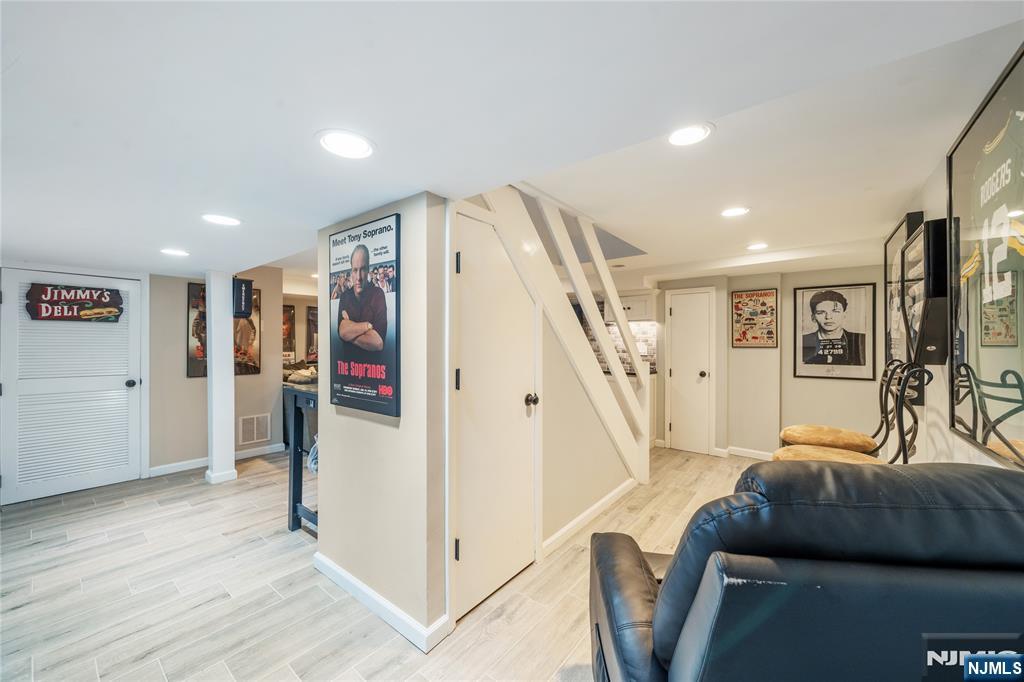 25 Glenview Road Nutley, NJ 07110 - Photo 38 of 49 a living room with furniture and a ceiling fan