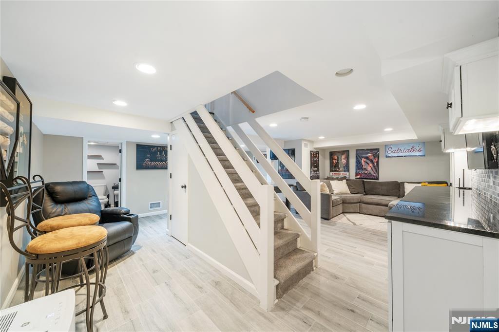 25 Glenview Road Nutley, NJ 07110 - Photo 39 of 49 a living room with furniture and a table